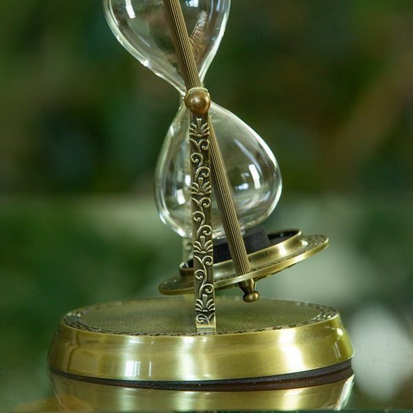 Brass Hibiscus Rotating Urn Hourglass