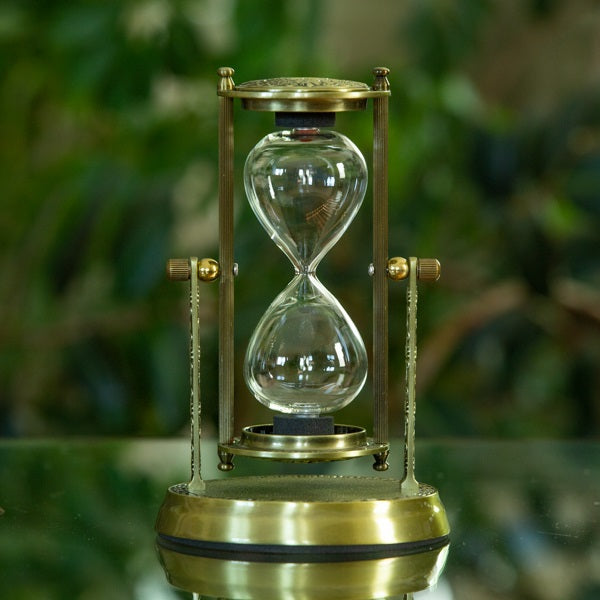 Brass Hibiscus Rotating Urn Hourglass